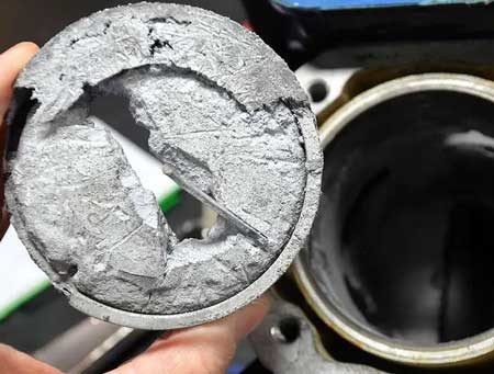 Piston damage caused by faulty fuel injector